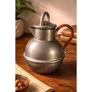 R.H. Macy & Co. Pewter Pitcher with whicker handle